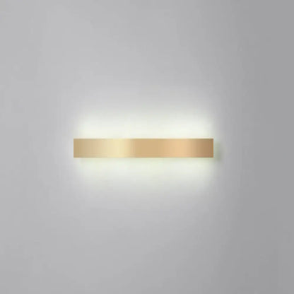 A minimalist gold plated led wall sconce with a sleek rectangular design and smooth metallic finish for living rooms