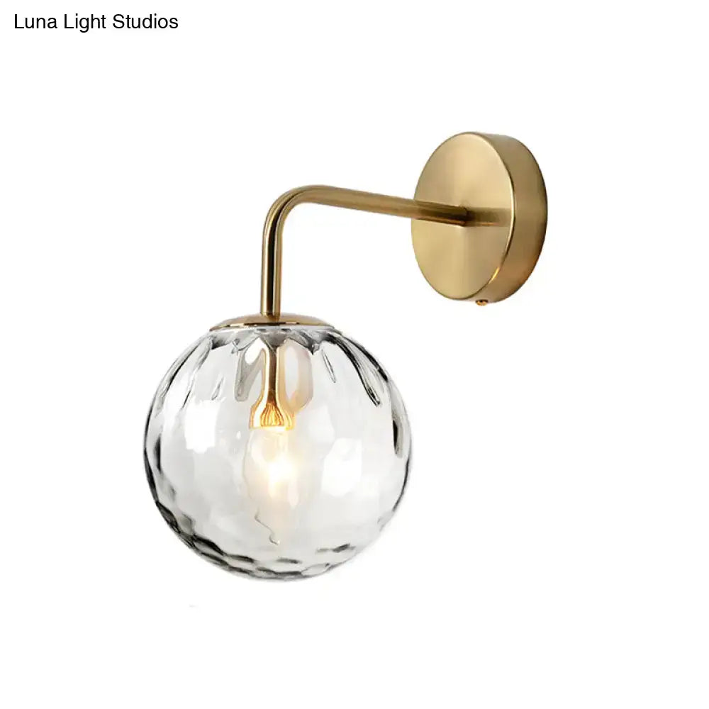 DecorBites™ minimalist wall lamp with rippled glass sphere, amber filament bulb, and polished brass hardware inches wide