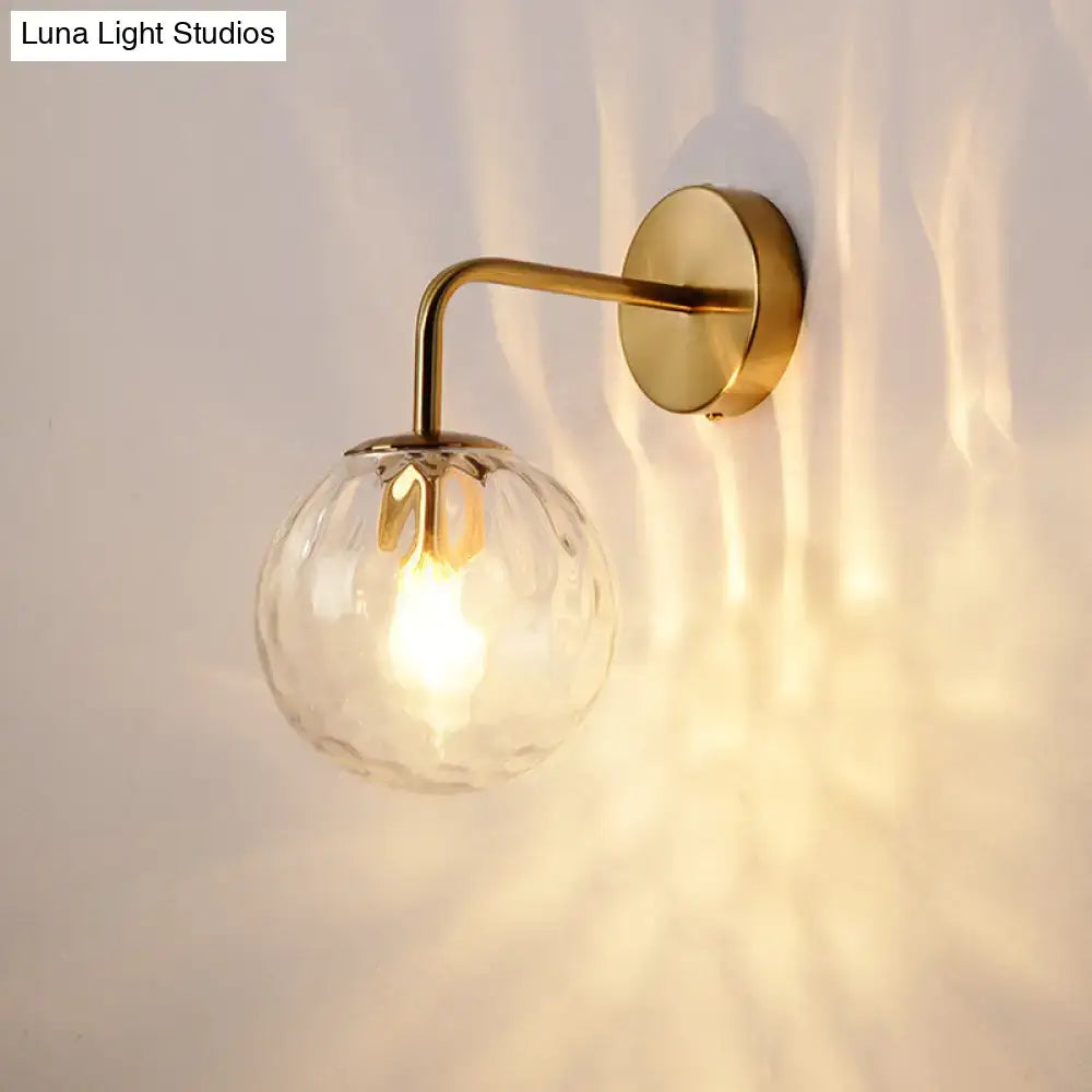 DecorBites™ wall lamp with warm brass sconce and rippled clear glass sphere measures inches wide for minimalist lighting