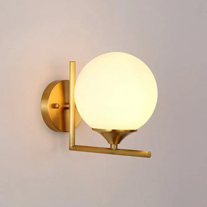 Minimalist gold sphere wall mounted light with frosted glass globe and metal frame for bedroom mounted light