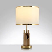 Decorbites minimalist table lamp with gold finish and cream fabric shade features vertical metal rods suitable for led incandescent lighting