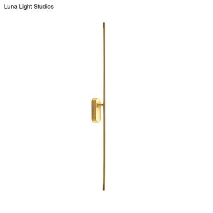 Minimalist gold vertical rod wall lamp offers a sleek rectangular light fixture perfect for living room decor