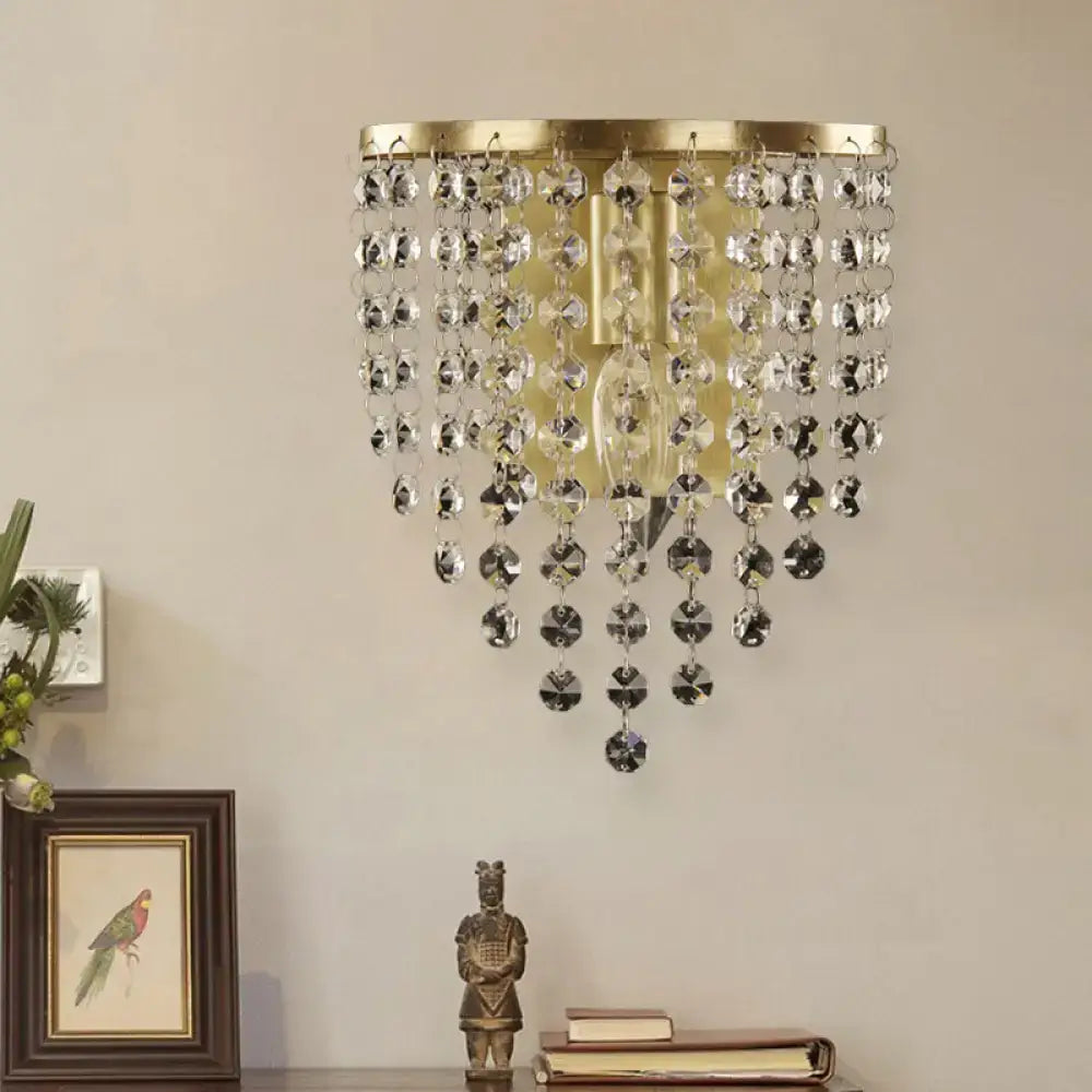 Minimalist gold wall sconce with cascading clear crystal beads for bedroom lighting and decor