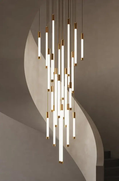Minimalist gold and white elegant led chandelier featuring slender glowing tubes capped in polished gold for living room