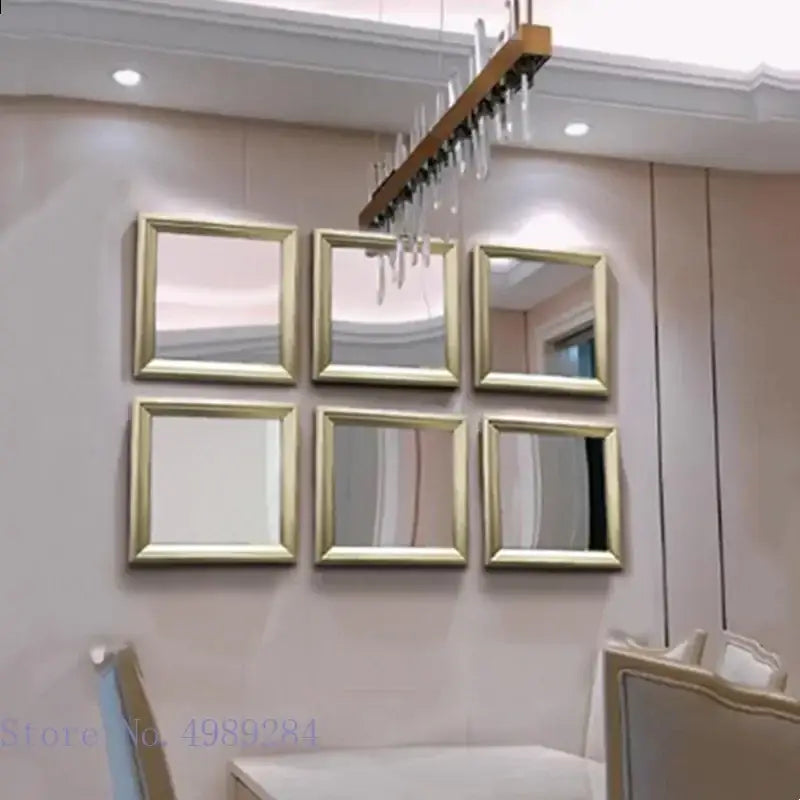 Set of six minimalist square mirrors with golden border frames arranged as wall decor for living room use