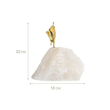 Minimalist golden man sculpture bookend with a golden figurine dancer atop a translucent white crystal base for home decor