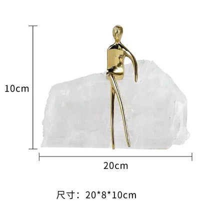 Minimalist golden man sculpture bookend with gold-colored abstract figure on translucent white crystal base for home decor