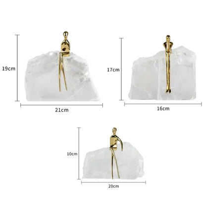Minimalist golden man sculpture bookends with gold-tone figurine on translucent crystal base for home decor by decorbites