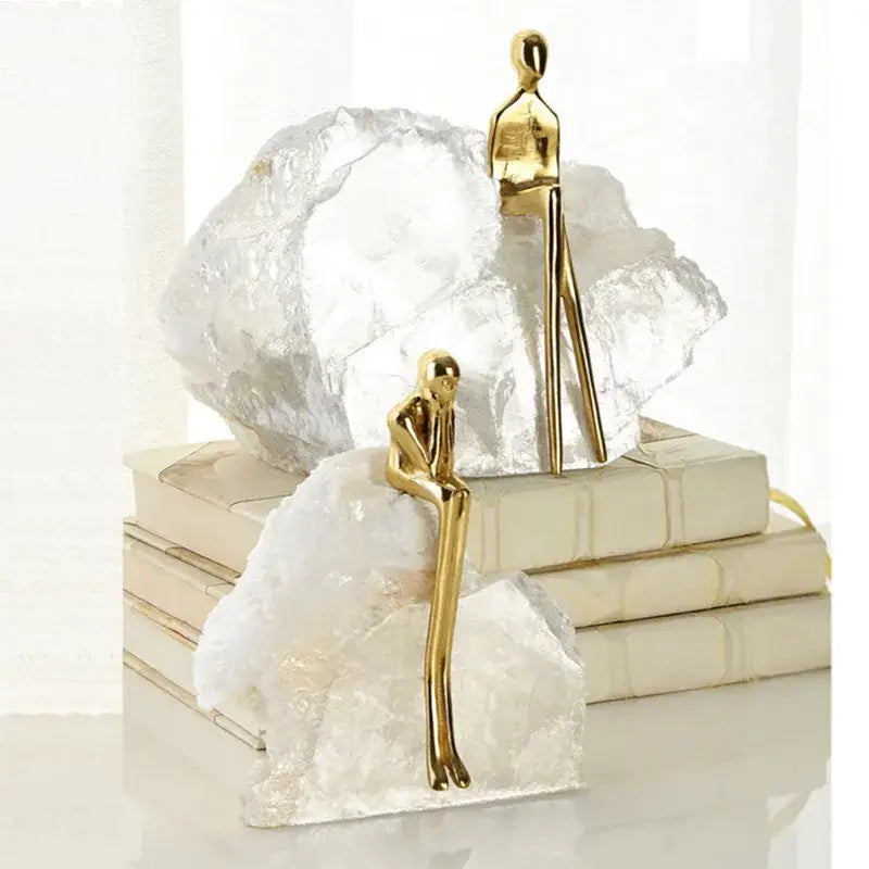 Minimalist golden man sculpture bookends with sleek smooth surfaces for home decor decorbites golden man design