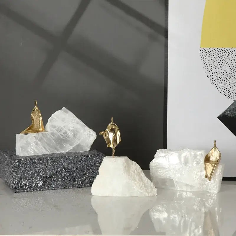 Minimalist golden man sculpture bookends in gold metal on white quartz bases for home decor by decorbites golden man
