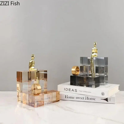 Minimalist golden thinker sculpture featuring gold-toned figurines on transparent acrylic thinker crystal base for decorbites office desk decor