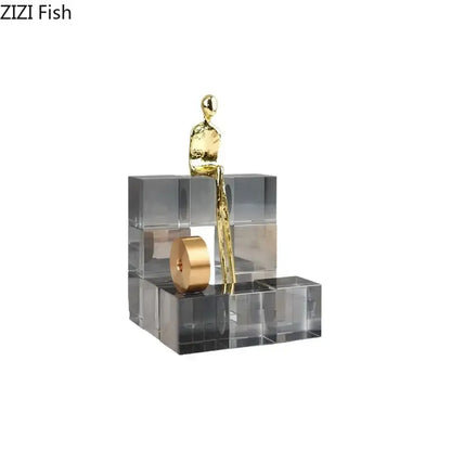Gold-toned abstract decorbites golden thinker perched on transparent acrylic thinker crystal base for office desk decor