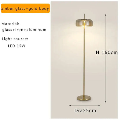 Minimalist amber glass floor lamp with gold-toned metal stem and led light for living room decor and lighting