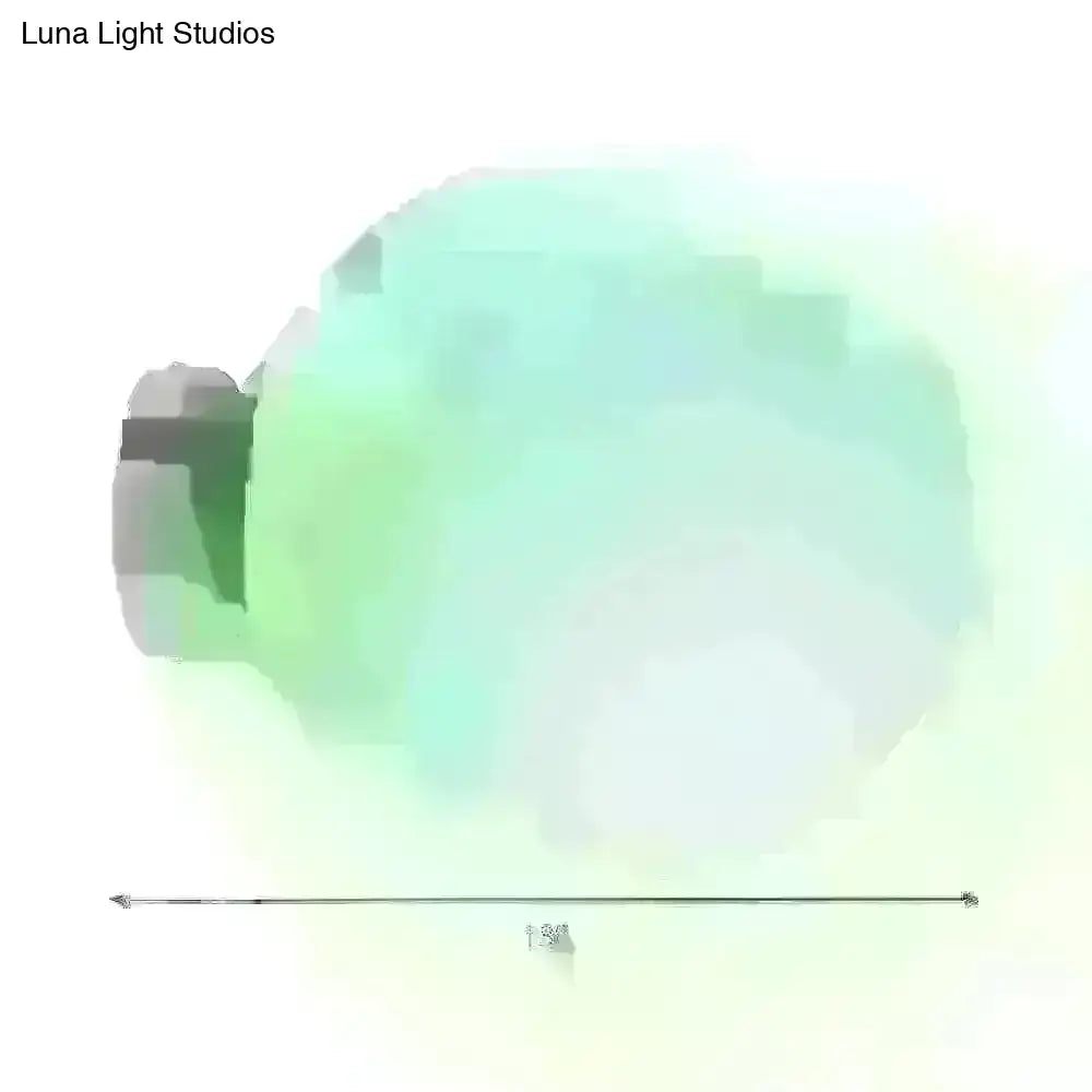 A translucent mint-green glass spherical sconce light with a dark gray cap for balcony wall use