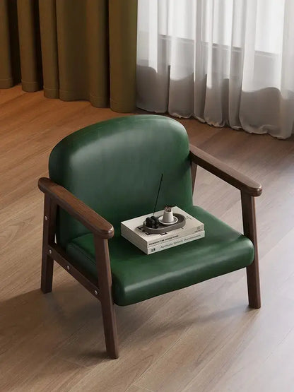 Minimalist green leather kids wooden chair with dark wood frame for a kids bedroom set