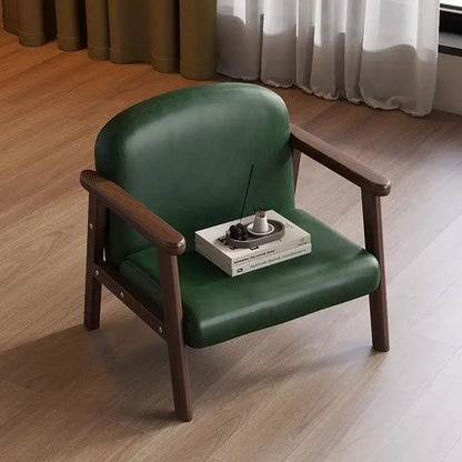 Minimalist kids wooden chair in dark green leather with wooden arms and legs designed for kids bedroom set