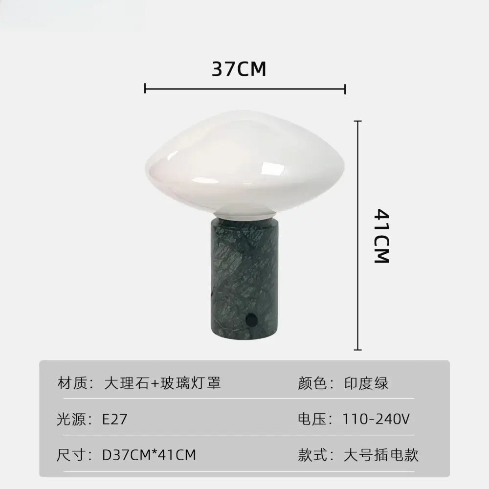 A minimalist table lamp with a glossy white glass shade and decorbites green marble led base for bedroom use