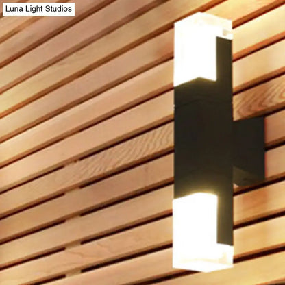Modern black and white minimalist led wall lamp with sleek rectangular design and warm white light for outdoor use