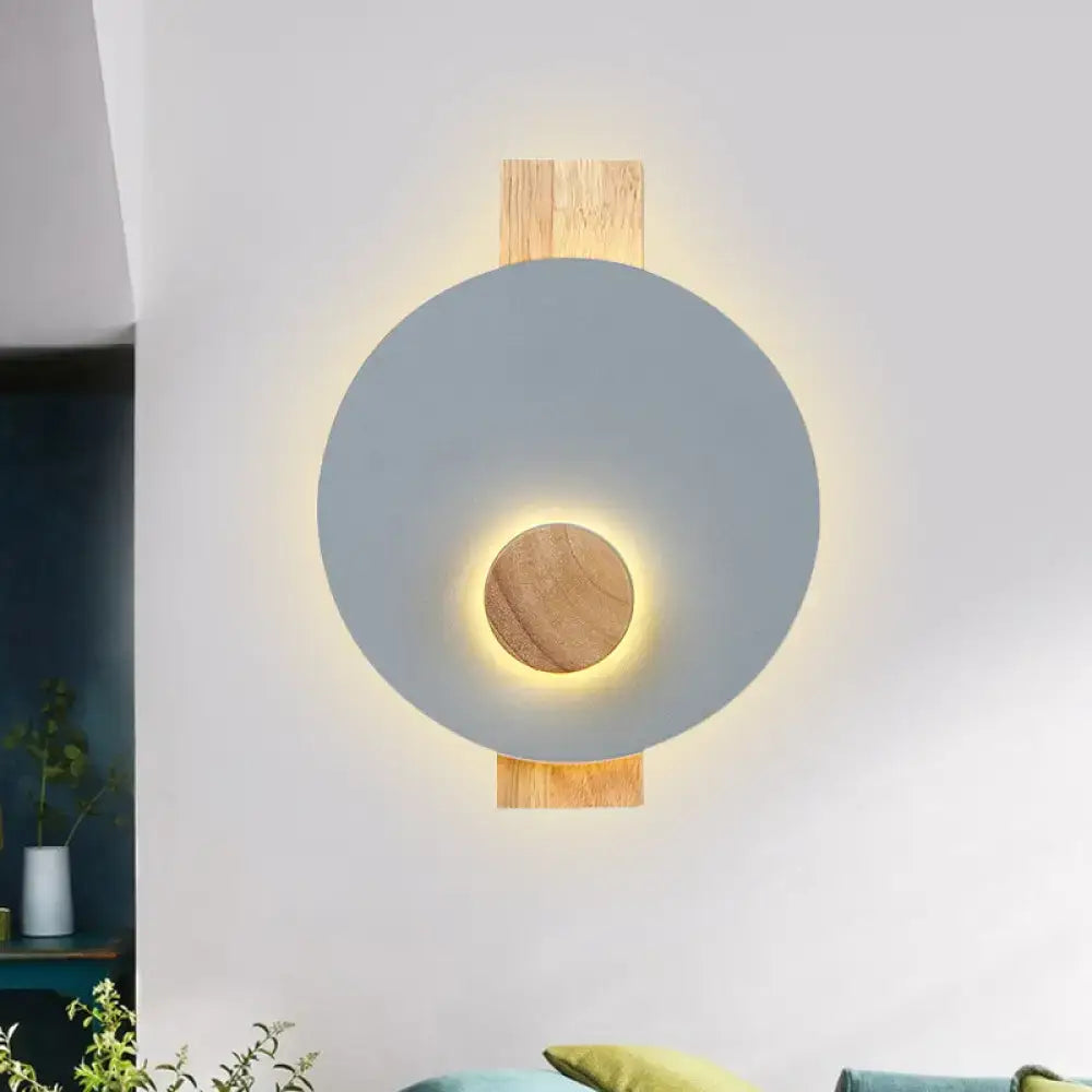 Minimalist led gray metal disk wall sconce with matte gray shade natural wood accents warm ambient lighting 110v-120v