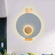Minimalist led gray metal disk wall sconce with matte gray shade natural wood accents warm ambient lighting 110v-120v