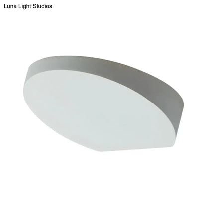 Minimalist led oval wall sconce with matte grey aluminum finish and softly diffused light bulb for corridor lighting