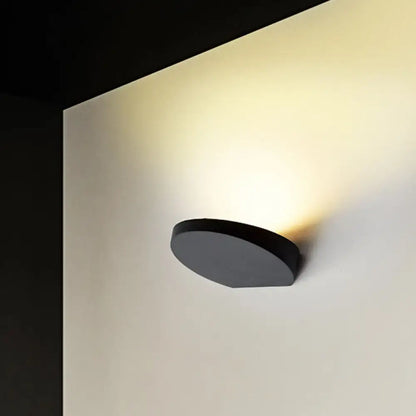 Minimalist led black circular wall sconce in grey aluminum with sleek design featuring light bulb for corridor lighting