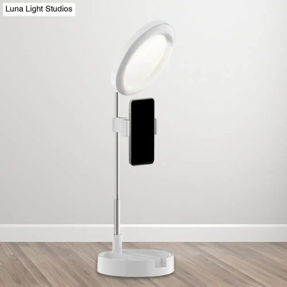 Minimalist white led ring light with phone holder and adjustable stand powered by usb power source for bedroom use