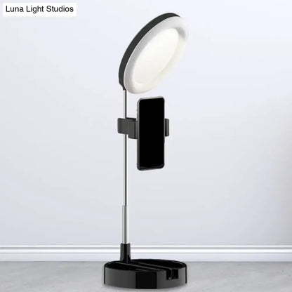 Minimalist black and silver led ring light with phone holder base powered by usb power source for bedroom use
