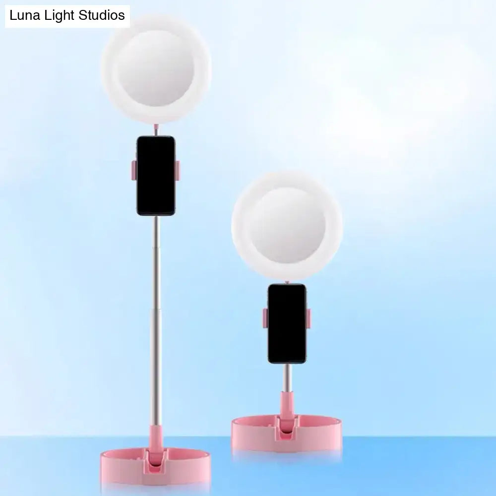 Minimalist pink and silver adjustable led ring light with phone holder and usb power source for bedroom use