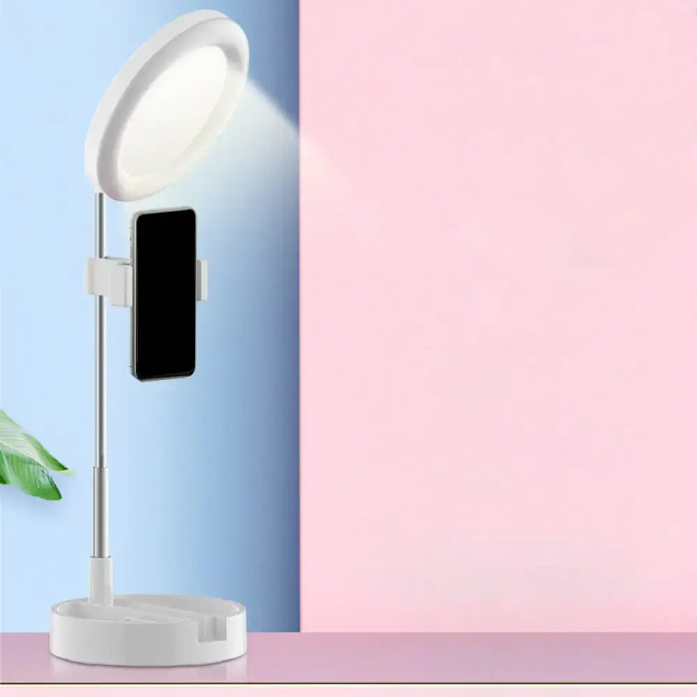 Minimalist white circular led ring light with adjustable stand and phone holder featuring usb power source for bedroom use