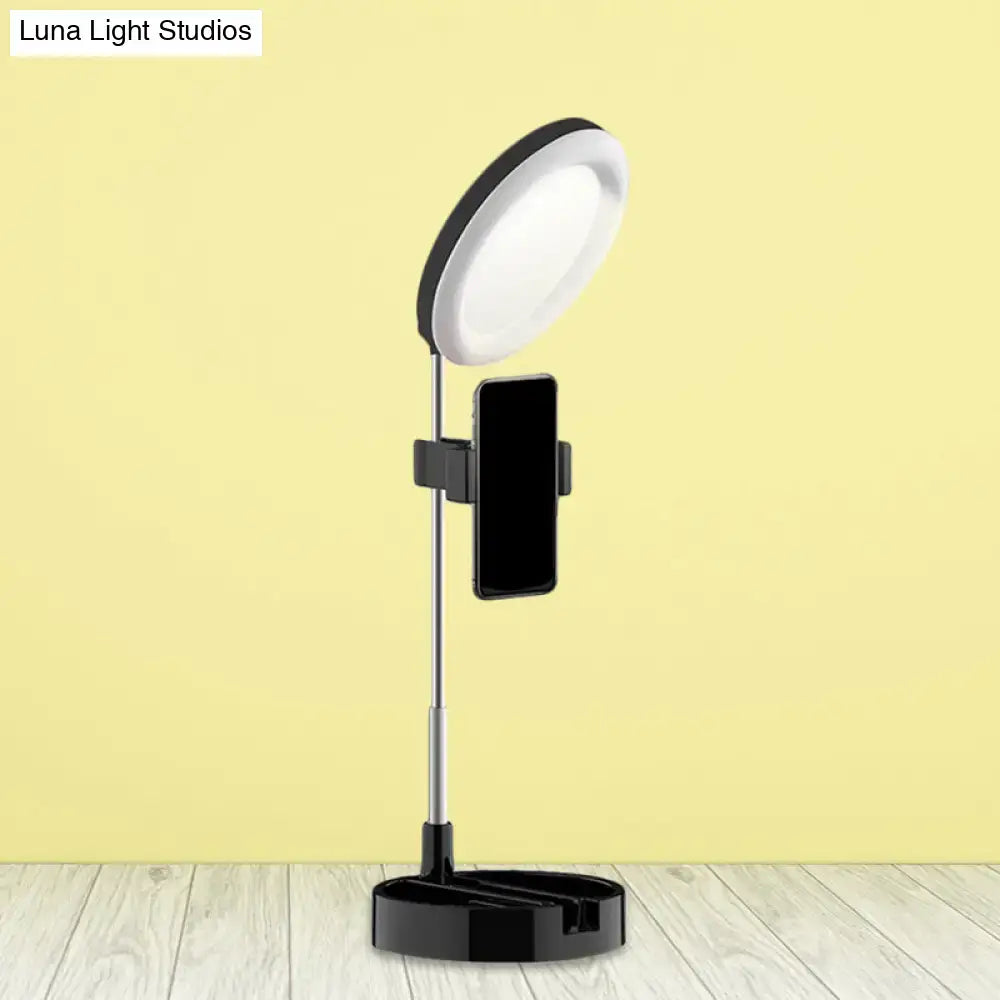 Minimalist black and white led ring light with phone holder and usb power source for streaming and photography