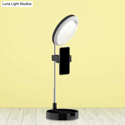 Minimalist black and white led ring light with phone holder and usb power source for streaming and photography
