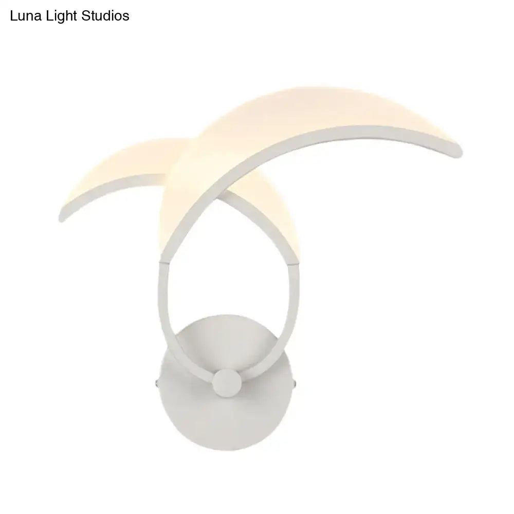 White crescent moon-shaped double curved minimalist led wall sconce providing warm white light for bedroom use