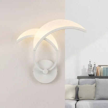 Minimalist led white double curved wall sconce with warm white crescent-shaped diffusers and circular base for bedroom lighting