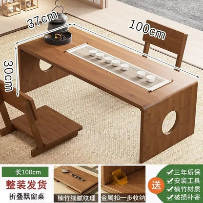 Minimalist light brown bamboo folding table 100cm long with natural finish and circular cutouts on legs for bedroom tea desk