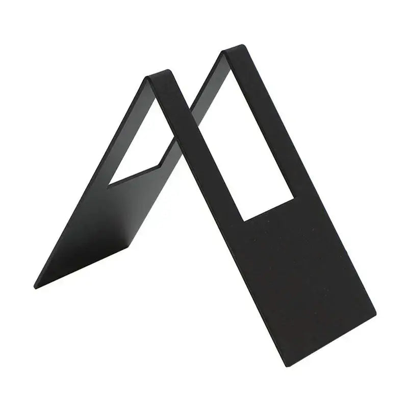 Black metal a-frame bookends with sleek minimalist design complement a light wood coffee filter holder kitchen paper dispenser