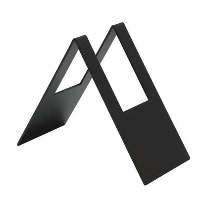 Black metal a-frame bookends with sleek minimalist design complement a light wood coffee filter holder kitchen paper dispenser