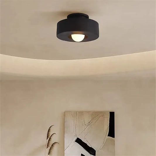 Minimalist matte black round ceiling light with warm bulb by decorbites perfect for modern bedroom decor