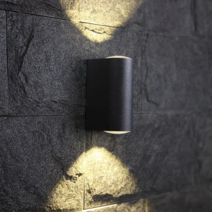 Minimalist matte black cylindrical wall light with a tube design and matte finish for outdoor use wall light type