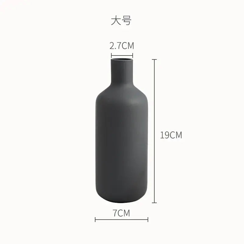 A sleek matte black ceramic geometric vase with minimalist bottle shape for living room decorbites geometric ceramic use