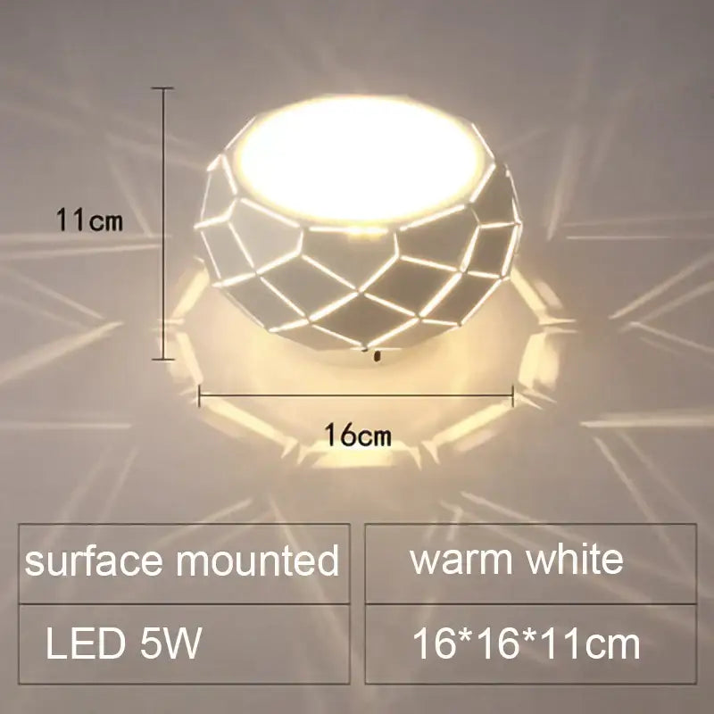 Minimalist metallic dimmable led ceiling light with geometric faceted design and warm white glow decorbites led ceiling