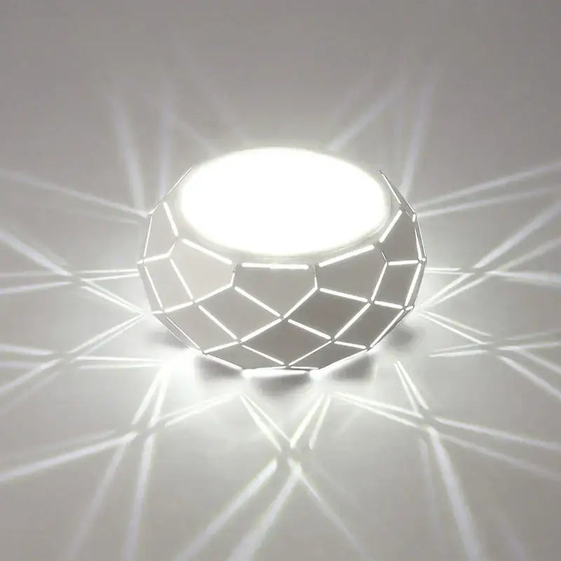 Minimalist geometric white led table lamp with faceted design casting sharp shadows for decorbites led ceiling light decor