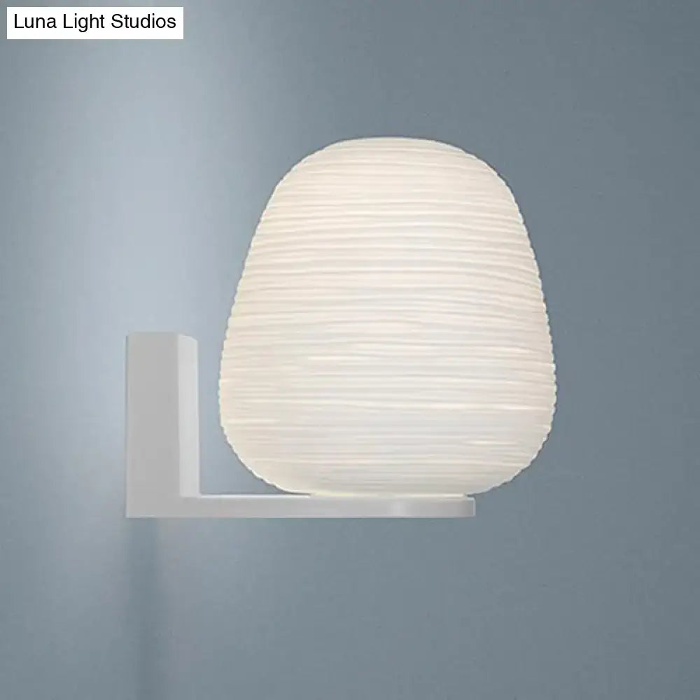 Minimalist white ribbed glass wall mounted lighting with milky ribbed paper lantern and metal bracket for bedroom use