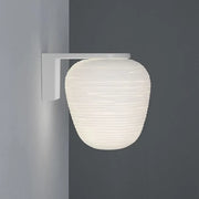 White ribbed glass lantern wall sconce with minimalist metal bracket for wall mounted lighting in bedroom use