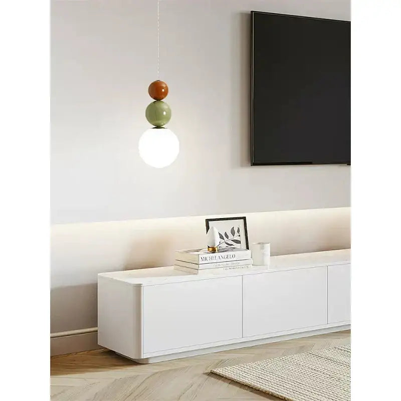 Minimalist nordic pendant light with three stacked matte orange sage green and white spherical bulbs for bedroom decorbites cream style