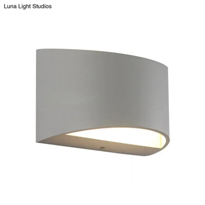 Minimalist off white led wall light featuring a modern gray curved metal sconce with warm ambient lighting