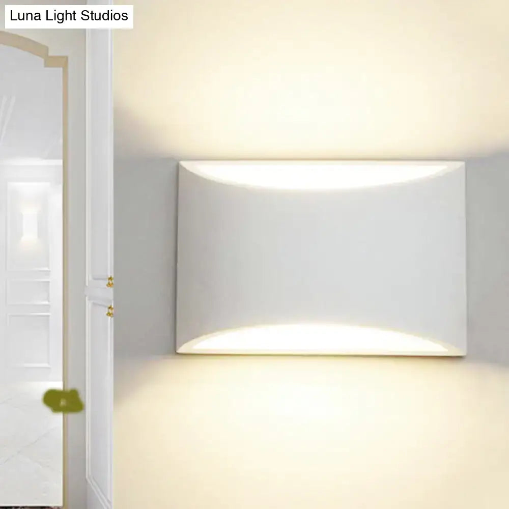 Minimalist off white led wall light featuring a modern rectangular metal wall sconce with curved softly glowing panels