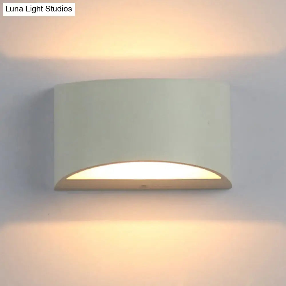 Minimalist off-white led wall light with curved metal sconce design providing warm ambient lighting for bedroom