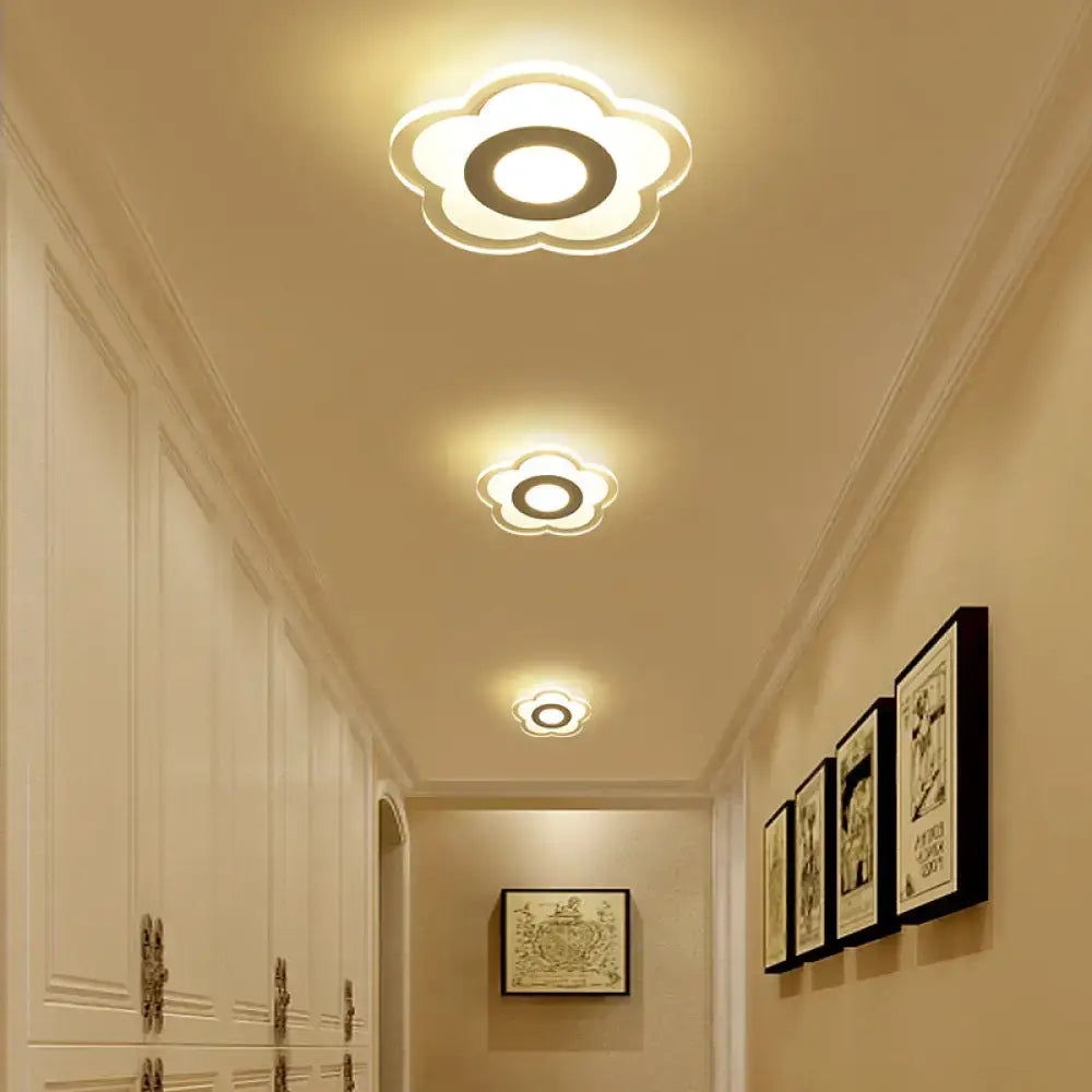 Minimalist off white square wall lamp featuring a warm glowing cloud-shaped triangle round layered design for bedrooms