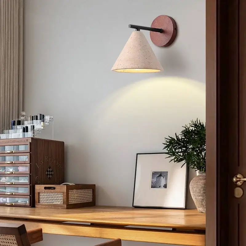 Minimalist concrete cone wall sconce with matte pink backplate and black arm for yellow travertine wall lights decorbites iron yellow